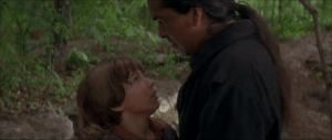Injun Joe, finding out that Tom was the observer in the graveyard, surprises Tom and threatens to kill him