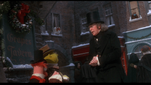Scrooge, having turned over a new leaf, finds the charity volunteers and offers them a large sum to help the homeless and destitute