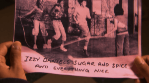 Izzy finds the photos Rodney took posted all over the school