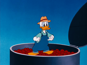 Donald stands on top of the apple silo after placing the apples Chip and Dale stole inside