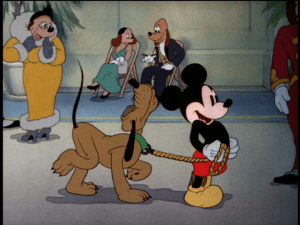 Mickey takes Pluto to the stand, with the two holding their heads high