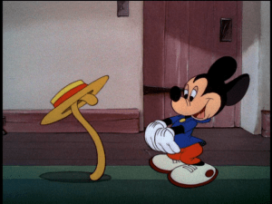 Mickey dances with his cane while Minnie plays the new electric organ