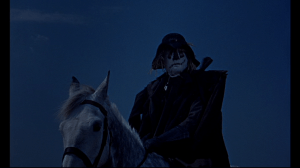 The Scarecrow surveys his men's work with the smuggling of supplies