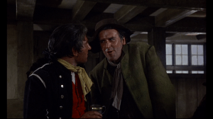 Mr. Mipps, in disguise, pretends that he can help the press-gang capture the Scarecrow