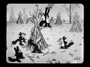 The squirrels continue to gather food, even from the corn nearby