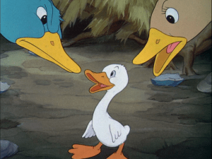 Father and mother duck look at their strange duckling with suspicion