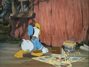 Donald is hard a work posting the bills on the side of a barn