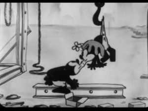 As Oswald and Ortensia kiss, the foreman uses a hook to pull Ortensia away
