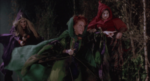 The witches arrive at the graveyard, ready to take the book away from the kids