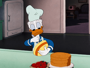 Donald finishes making a cake, unaware of the chaos he has created by his act of charity