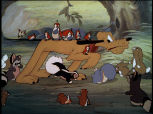 Pluto, keeping still to make Mickey happy, is surrounded by curious animals