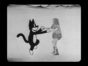 Alice dances with Julius after she drifts off to the cartoon world