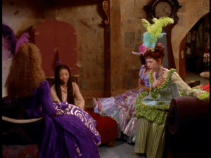 As she tends to her stepfamily, Cinderella asks them questions about the ball