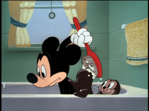 Mickey notices something is wrong when he is scrubbing something, but it's not his back