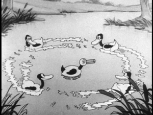 Pluto hides in the pond with his disguise, hoping to lure enough ducks for Mickey to hunt