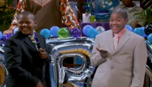 Corey takes the stage at his party, excited to see everyone - and their checkbooks