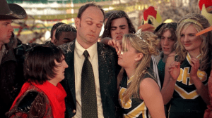 Poole faces the ridicule of the town before being taken in for questioning by the police