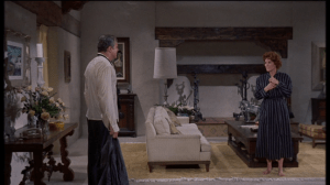 Mitch is surprised to find Margaret in his house, and in his bathrobe