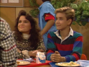 Zack sits with Karen, trying to keep up the charade that he's in the ninth grade