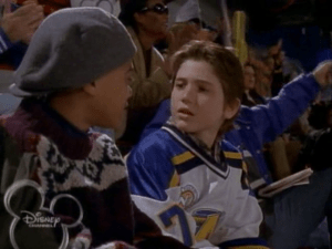 Charlie awkwardly sits with his friends, trying not to get found out