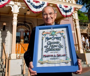 (July 17, 2009) Marty Sklar, Executive Vice President and Walt Disney Imagineering Ambassador holds his tribute window at Disneyland in Anaheim, Calif., on Friday, the 54th anniversary of the opening of Disneyland. In a tradition begun by Walt Disney, second-story windows along Main Street USA pay tribute to the men and women who were instrumental in the creation and operation of Disneyland. Sklar's window, unveiled this morning, can be seen above City Hall at Town Square in Disneyland. Sklar, who began his Disney career in June 1955 as editor of "The Disneyland News," went on to work personally with Walt Disney on the creation of landmark Disney attractions for the 1964 World's Fair and leading the design of Walt Disney's final vision, Epcot. (Paul Hiffmeyer/Disneyland)
